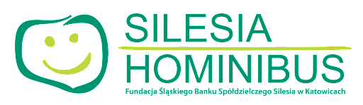 Logo fundacji Silesia Hominibus z uśmiechniętą buzią i nazwą.